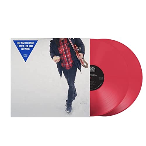 Red vinyl record with album cover featuring a man in a red plaid shirt.