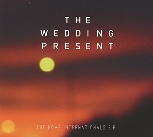 CD cover for The Wedding Present’s “The Home Internationals EP,” with blurred orange sky.