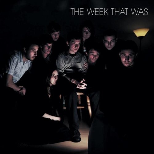CD cover: group portrait in dim light, focused on central figure.