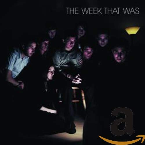 CD cover: group of people in a dimly lit room.