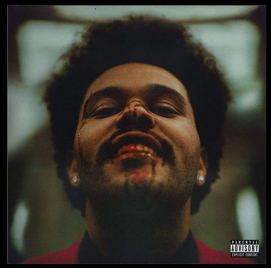 The image is a close-up of a man's face with his eyes closed, wearing earrings. Alt text: Man with closed eyes and earrings on vinyl record cover.