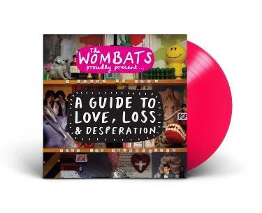 "Pink vinyl record with a collage album cover featuring The Wombats' album title."
