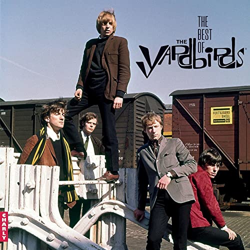 The Yardbirds band portrait with railway cars in the background.