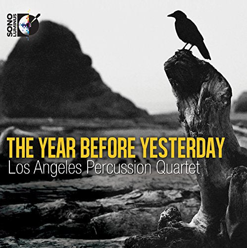Black-and-white album cover with a crow perched on a tree stump, yellow and white text.