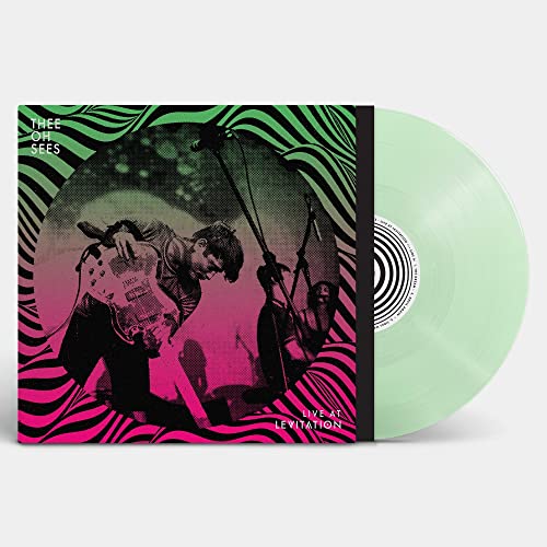 Thee Oh Sees album cover with a musician and clear vinyl record.