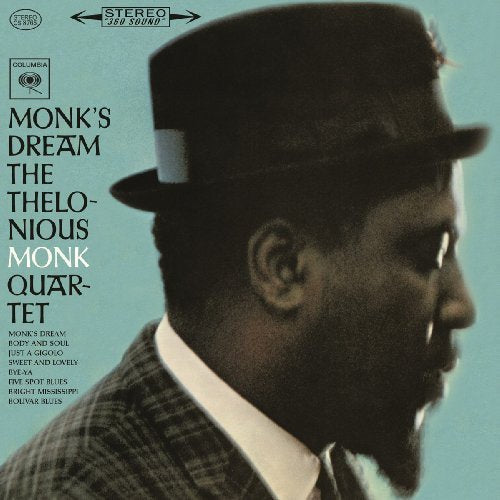 "Album cover featuring Thelonious Monk in a hat against a teal background."