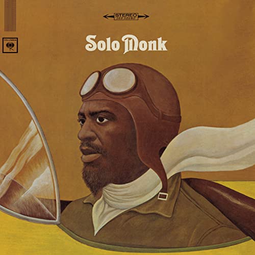 Thelonious Monk's portrait in aviator gear on a brown and yellow background.