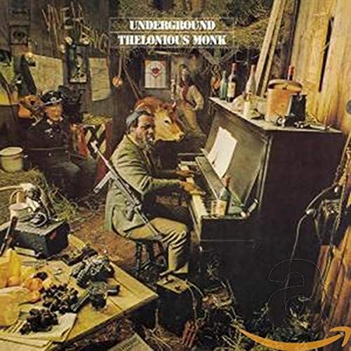Thelonious Monk playing piano in a cluttered room with a rifle and other figures.