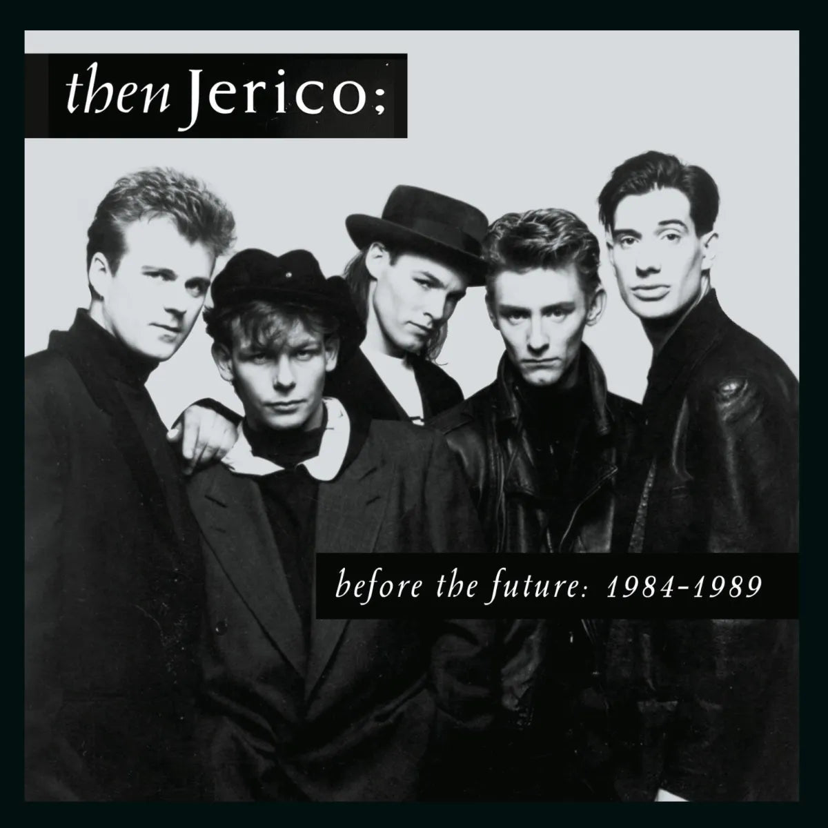 Black and white photo of four men, the band Then Jerico.