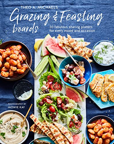 Cookbook cover with a vibrant snack board featuring fruits, dips, and bread.
