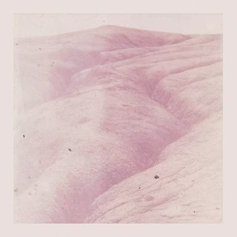 Vinyl record cover with a pink and white abstract landscape.