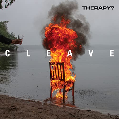 Burning chair by water, hand holding glass, album cover "CLEAVE" by Therapy?.