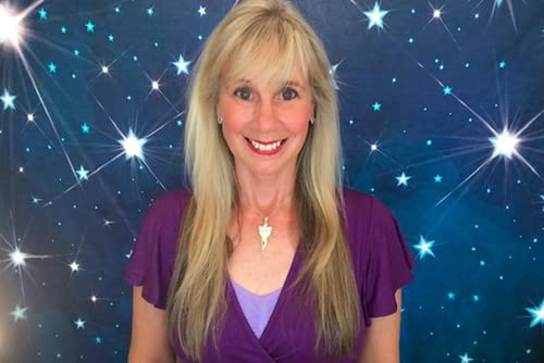 Woman with blonde hair smiling against a dark blue starry background.