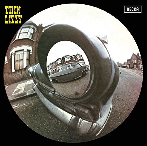 Thin Lizzy album cover featuring a car viewed through a tire’s circular frame.