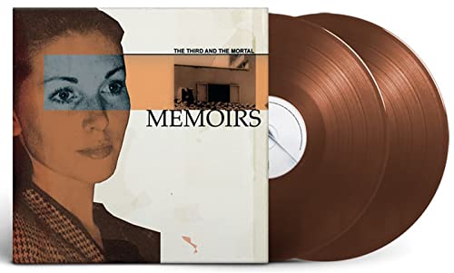 Brown vinyl records and album cover with woman's face and text.