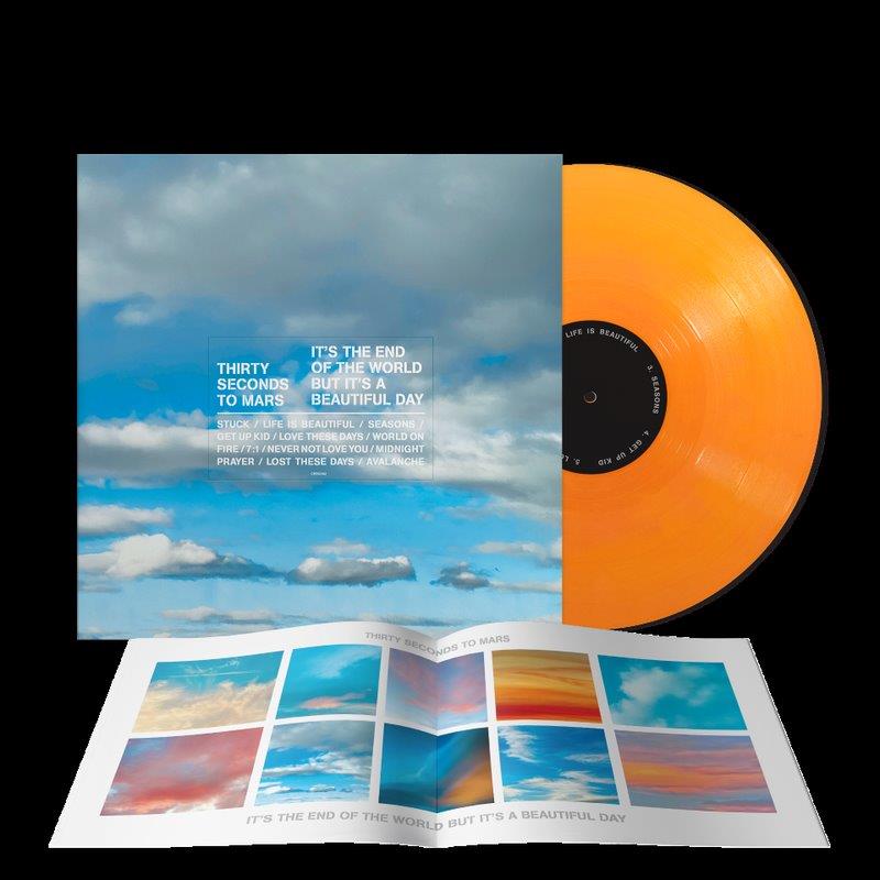 "Orange vinyl record with sky-themed album cover and booklet featuring multiple sky images."
