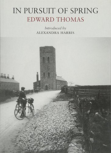 Book cover featuring a cyclist on a road near a stone church tower.