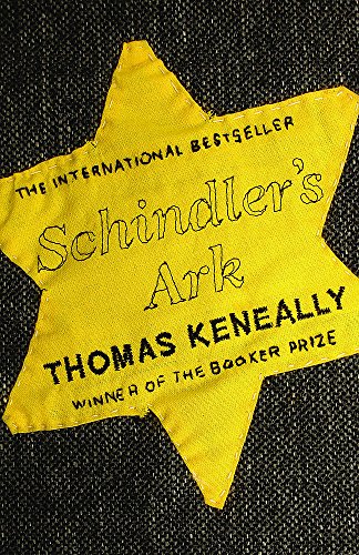 Yellow star-shaped fabric patch with black embroidered text reading Schindler's Ark by Thomas Keneally.