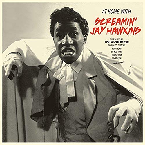 CD cover featuring a man in a suit with a shocked expression.