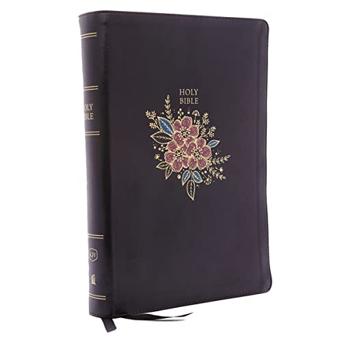 Black leather Bible with gold floral design and Holy Bible text on the cover.