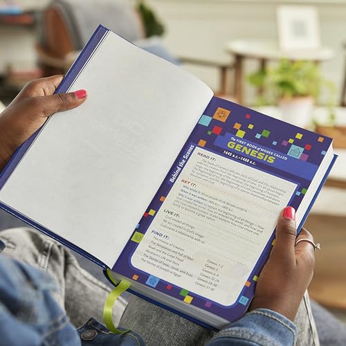 Open blue children’s Bible displaying the book of Genesis with colorful study notes.