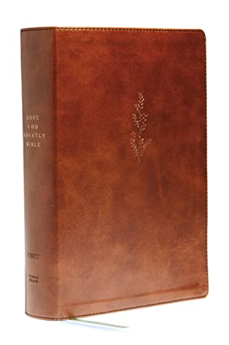 Brown leathersoft Bible with floral design and text on the spine.