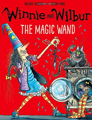 Winnie the witch and her cat Wilbur stand by a washing machine on red background.