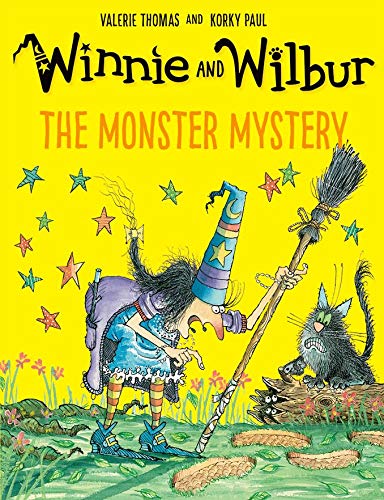 Winnie the witch and Wilbur the cat with a broom, yellow background.