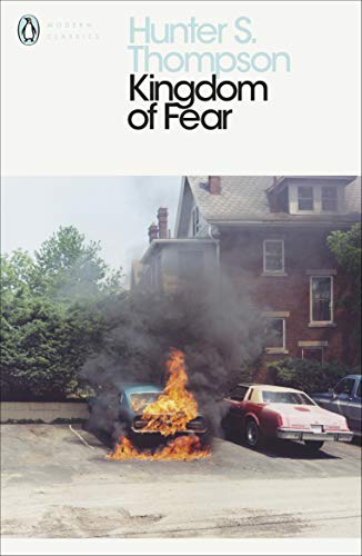 Book cover: “Kingdom of Fear” with a burning car in front of a house.