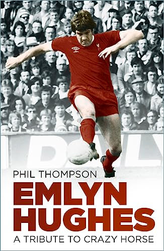 Emlyn Hughes in red Liverpool kit kicking a soccer ball, book cover.