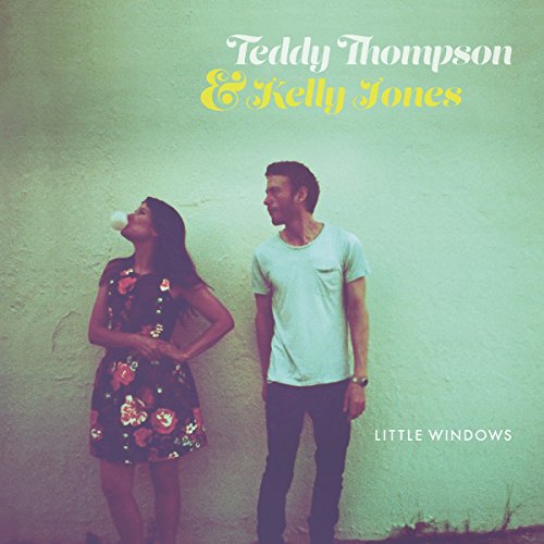 "Album cover featuring a man and woman standing against a green wall."