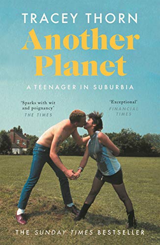 Book cover featuring a shirtless boy and girl kissing in a grassy field.