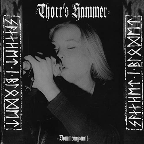 Black album cover featuring a portrait of a man singing into a microphone.