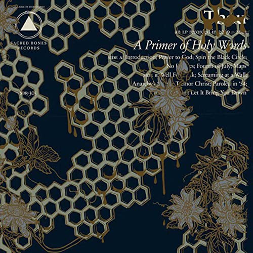 Dark blue vinyl record cover with gold honeycomb and floral designs.
