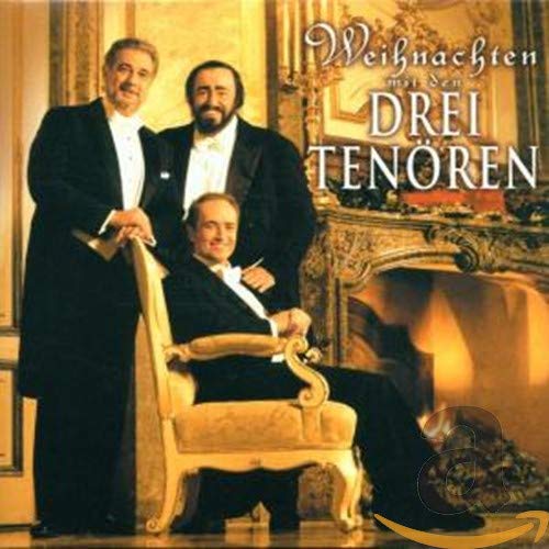 The Three Tenors in formal wear, posed near a fireplace.