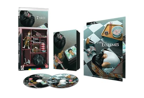 Three... Extremes" Blu-ray case with discs, featuring surreal imagery and a dark aesthetic.