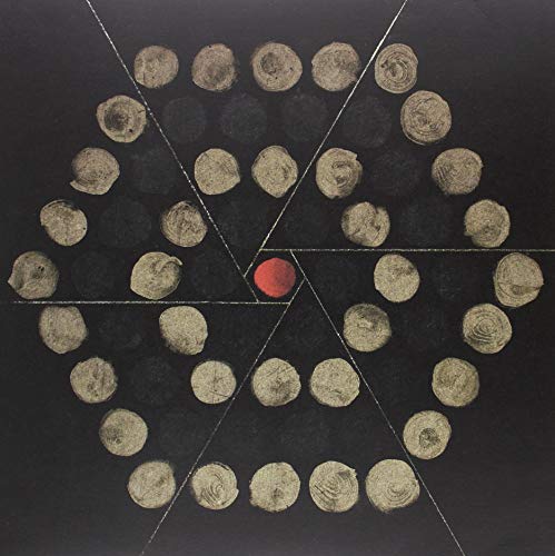 Black album cover with a spiral pattern of gold circles and one red center.