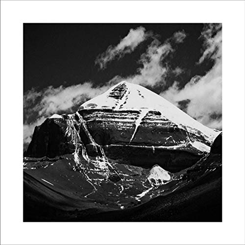 Black and white image of a snow-covered mountain peak with clouds.