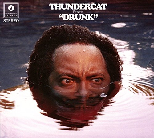 Thundercat’s “Drunk” vinyl cover: a man submerged in blue water, looking up.