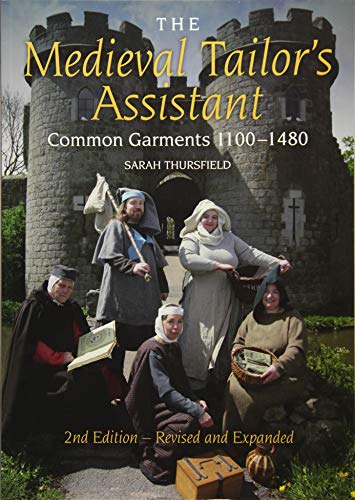 Book cover featuring five people in medieval attire posing before a stone castle.