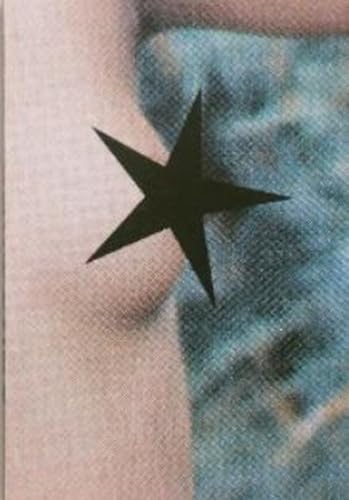 Black star shape obscuring part of a person’s skin, close-up view.