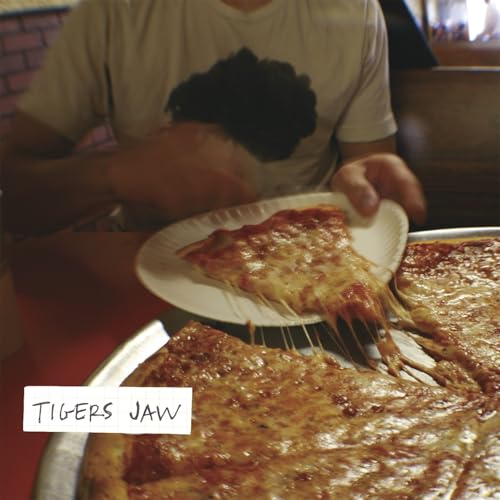 Hand pulling a slice of cheese pizza, album cover for Tigers Jaw.