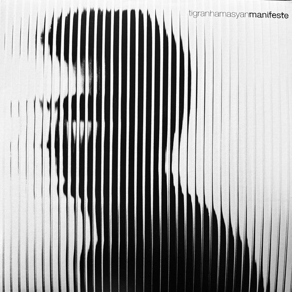 Black and white album cover featuring a distorted portrait of a man.