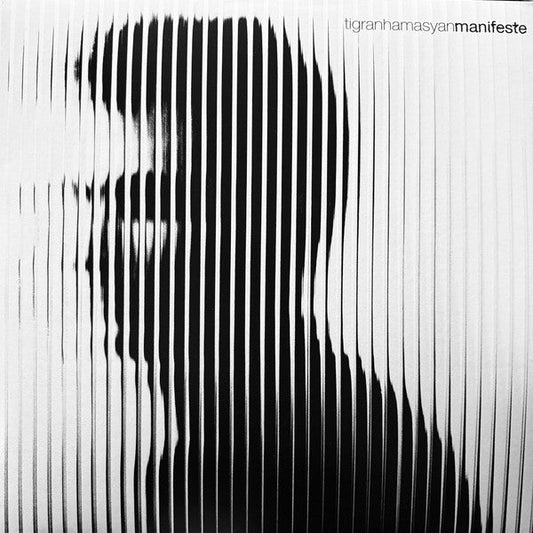 Black and white album cover featuring a distorted portrait of a man.