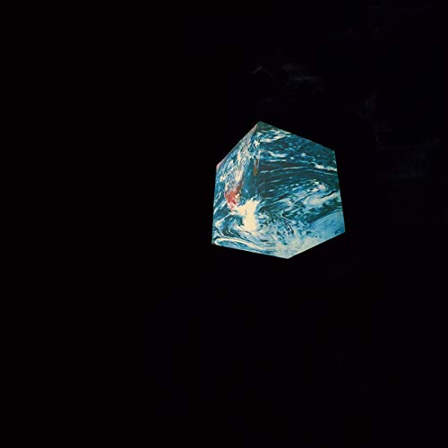 Album cover for Tim Hecker’s “Anoyo” featuring abstract blue and white swirls.