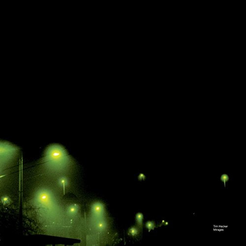 Dark green image of streetlights blurred by fog, album cover art.