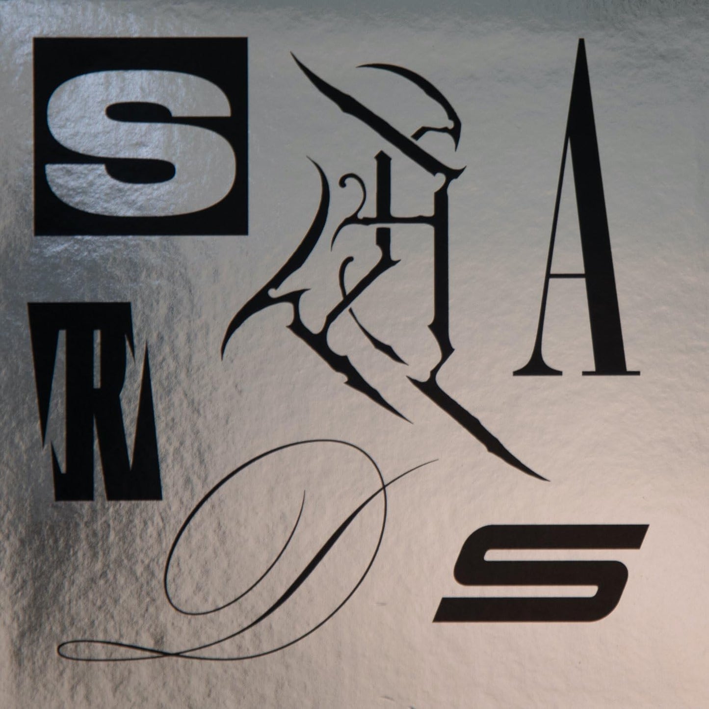 Black abstract lettering spelling "SHARDS" on a silver textured background.