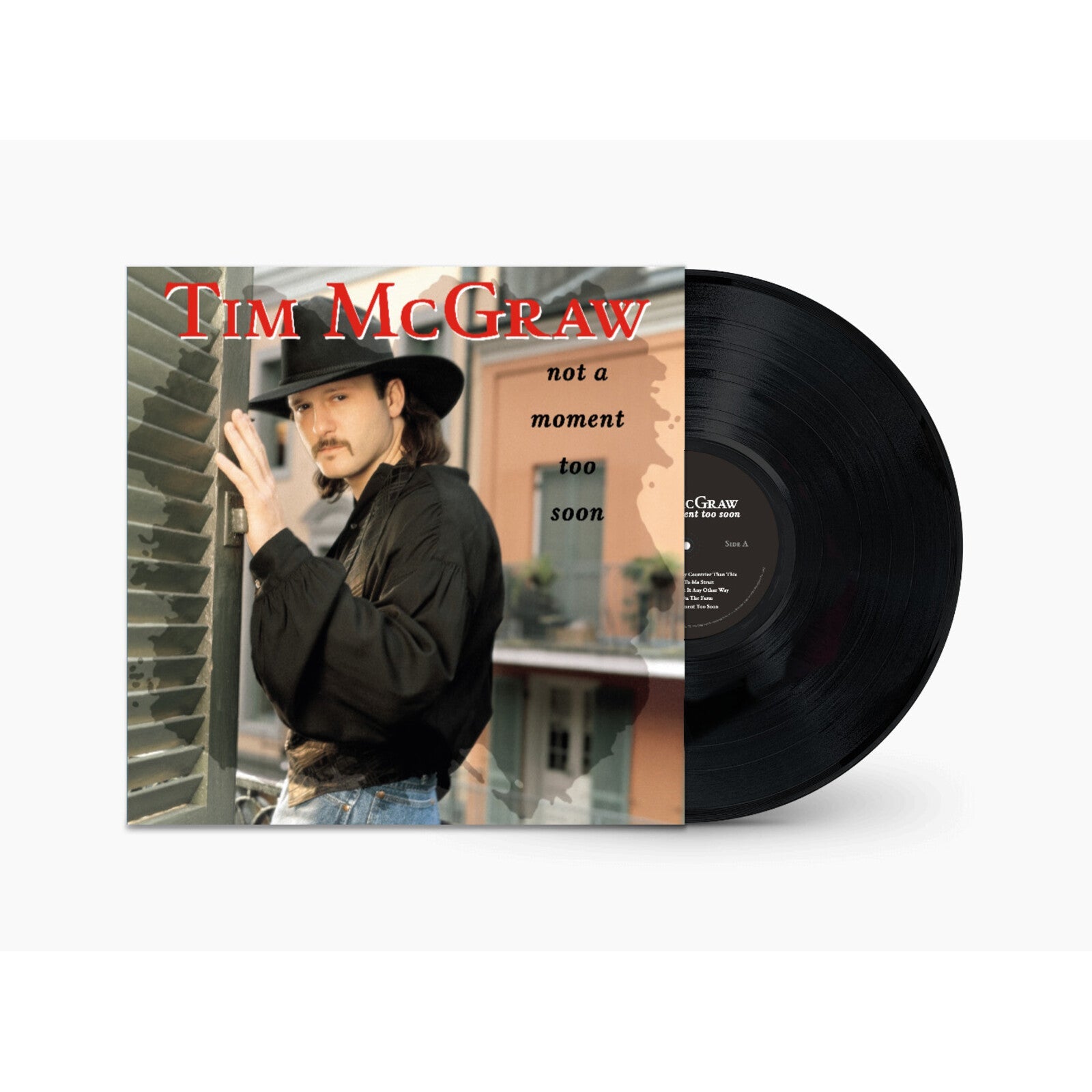 Tim McGraw album cover and black vinyl record displayed against white.