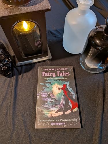 Book cover with spooky illustration, displayed with a candle and bottles.