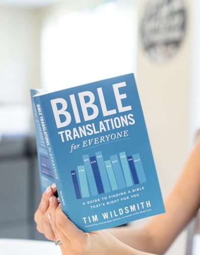 Blue book cover reading "Bible Translations for Everyone" held in hands.